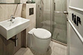 Self-contained bathroom with shower facilities