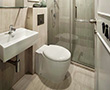 Self-contained bathroom with shower facilities